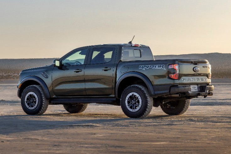 Red Ford Ranger Raptor parked on a hill