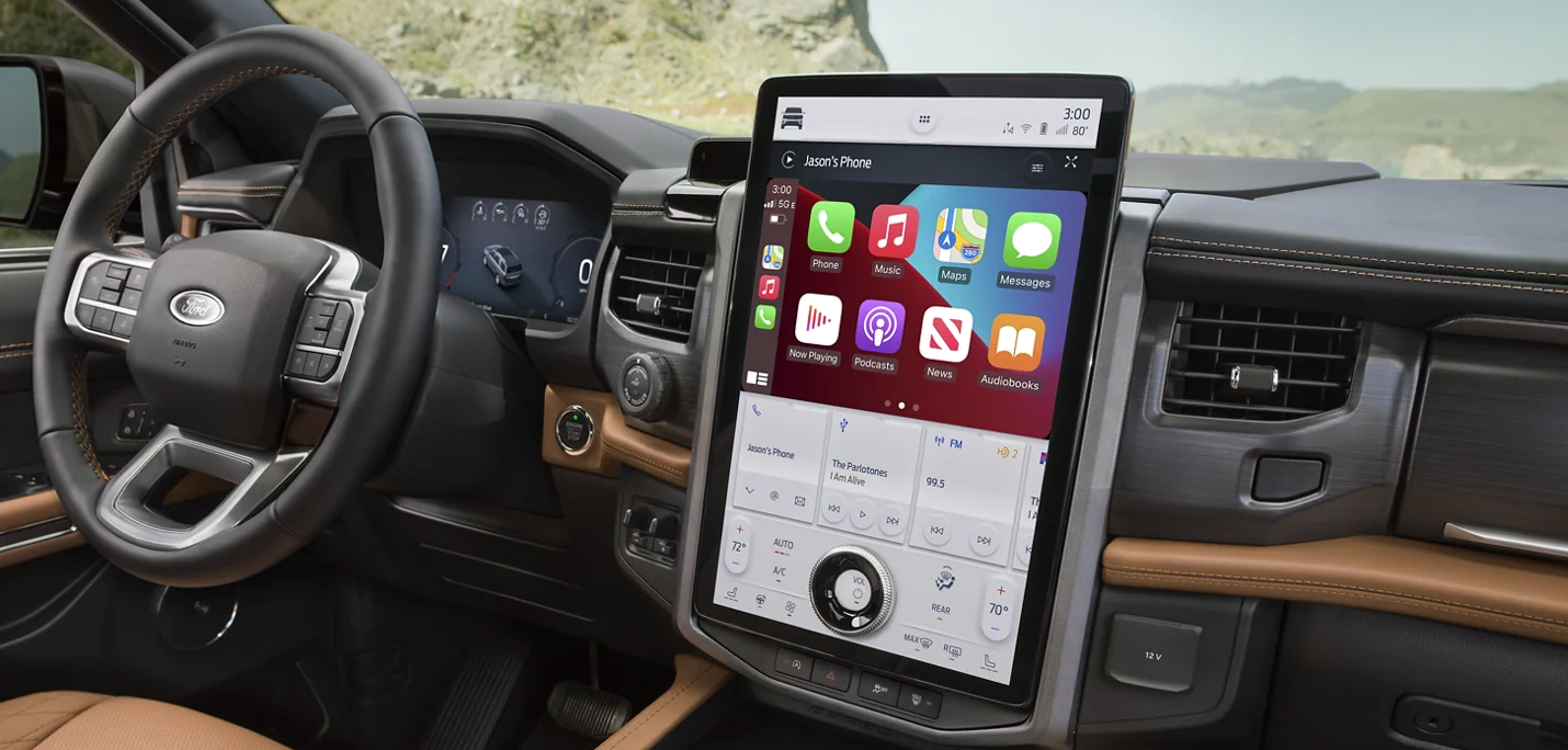 The interior of a Ford Expedition, showcasing its large touchscreen and spacious cabin.